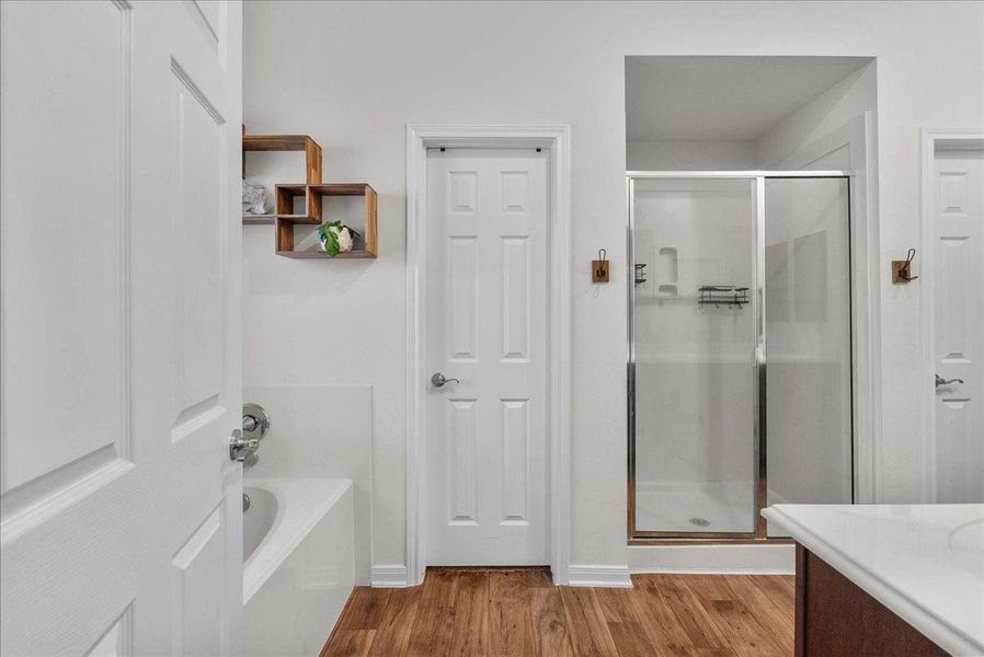The private en-suite bath features a walk-in shower, soaking tub, double sinks and a walk-in closet The private en-suite bath features a walk-in shower, soaking tub, double sinks and a walk-in closet