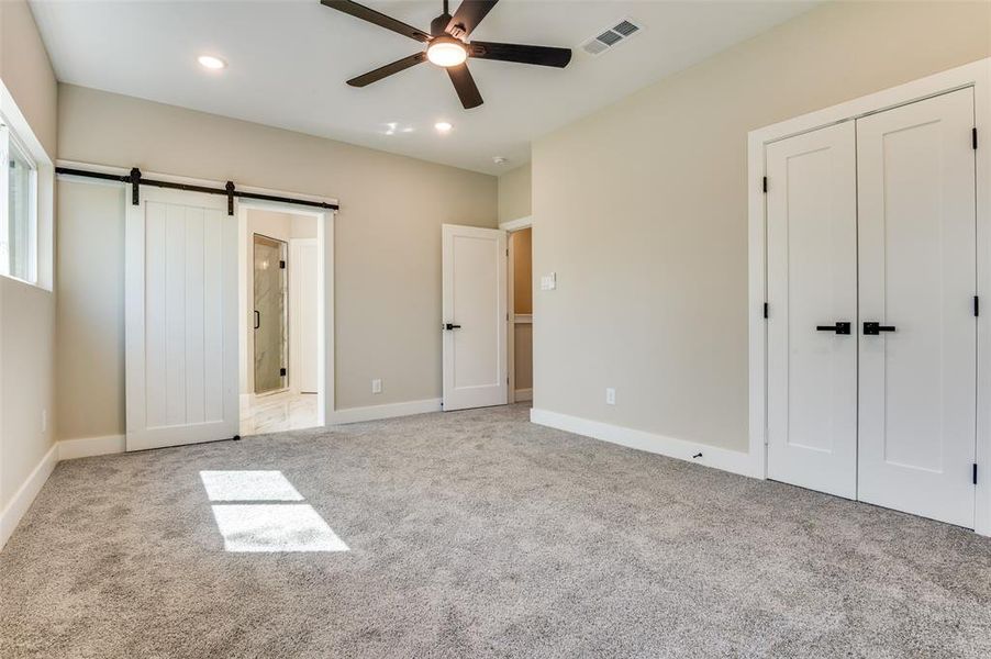 Owners suite, with barn door to bathroom, recessed lighting and ceiling fans for Owners suite, with barn door to bathroom, recessed lighting and ceiling fans for