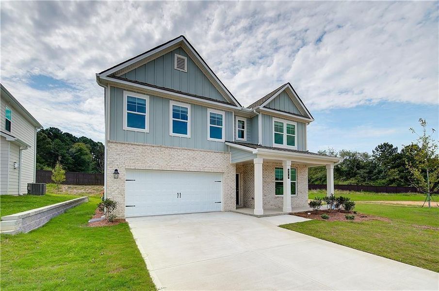 Front exterior of a new home in Abbotts Crossing, Conyers, GA, highlighting curb appeal (Image 18).