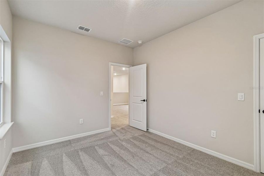 Spacious, unfurnished interior of a new home in Laureate Park at Lake Nona - Garden Series, Orlando (Image 23).