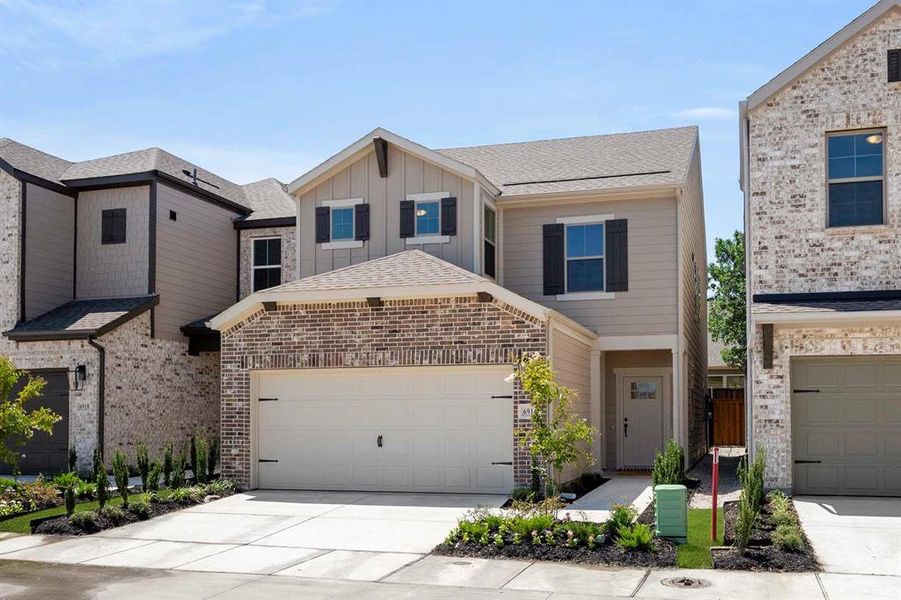 Front exterior of a new home in Sereno Oaks at Buckner Terrace, Dallas, TX, highlighting curb appeal (Image 17). Front exterior of a new home in Sereno Oaks at Buckner Terrace, Dallas, TX, highlighting curb appeal (Image 17).