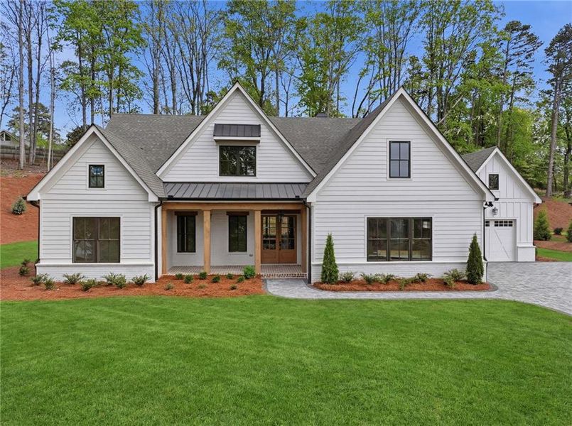Front exterior of a new home in , Cumming, GA, highlighting curb appeal (Image 1). Front exterior of a new home in , Cumming, GA, highlighting curb appeal (Image 1).