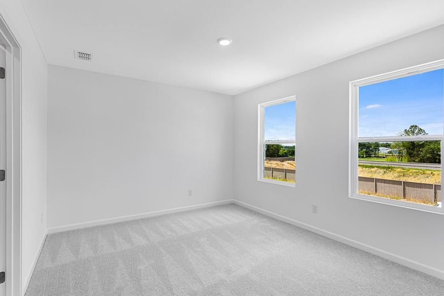 Representative unfurnished interior of a home built from the Avera by Taylor Morrison in Falls Creek, Flowery Branch (Image 31).