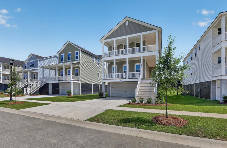 Front exterior of a new home in Heron's Walk at Summers Corner, Summerville, SC, highlighting curb appeal (Image 21). Front exterior of a new home in Heron's Walk at Summers Corner, Summerville, SC, highlighting curb appeal (Image 21).