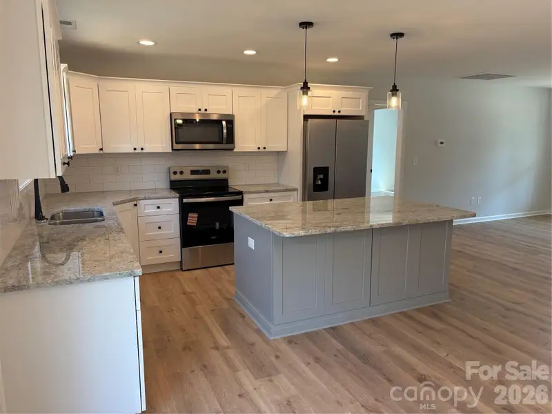 Furnished interior view inside a new home in , Statesville (Image 6).