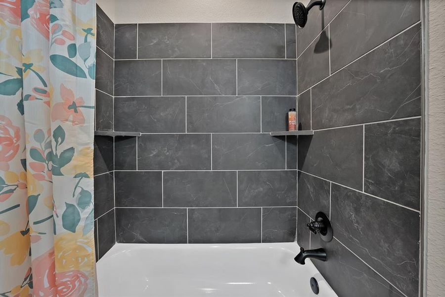 Steel tub and hand-tiled wall in 2nd bath Steel tub and hand-tiled wall in 2nd bath