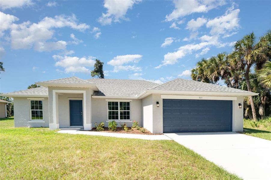 Front exterior of a new home in , North Port, FL, highlighting curb appeal (Image 1).