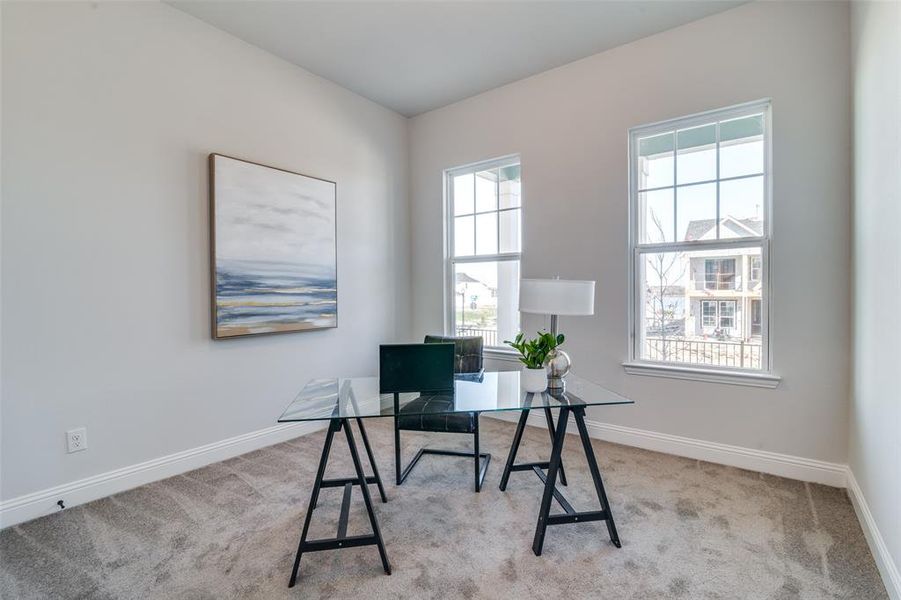 Office space with light colored carpet