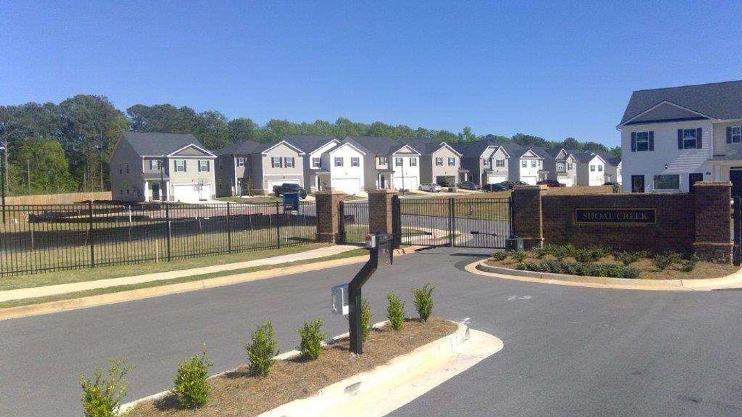 Front exterior of a new home in Shoal Creek, Hampton, GA, highlighting curb appeal (Image 2). Front exterior of a new home in Shoal Creek, Hampton, GA, highlighting curb appeal (Image 2).