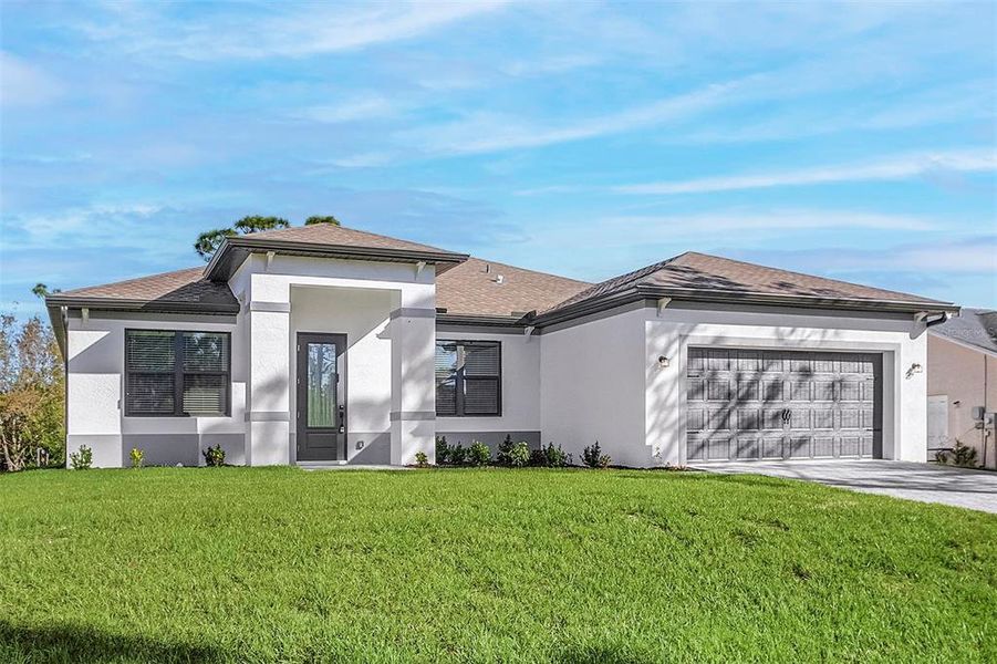 Front exterior of a new home in , Port Charlotte, FL, highlighting curb appeal (Image 2). Front exterior of a new home in , Port Charlotte, FL, highlighting curb appeal (Image 2).