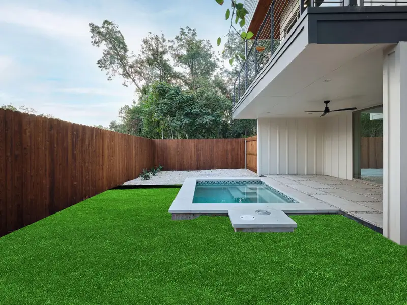 View of swimming pool featuring a patio, a balcony, ceiling fan, a fenced backyard, and an in-ground hot tub