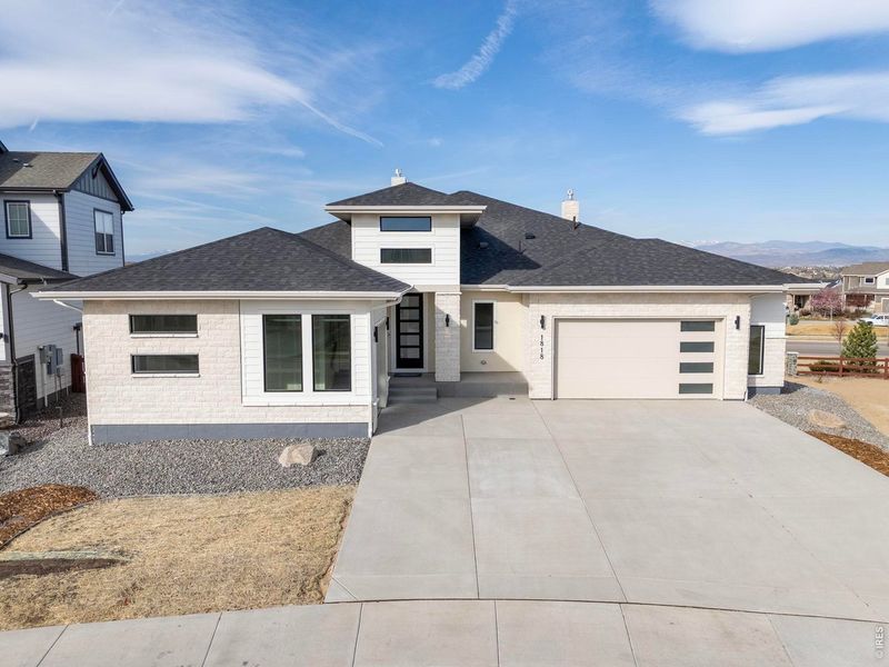 Front exterior of a new home in RainDance, Windsor, CO, highlighting curb appeal (Image 2).