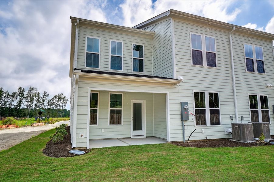 Front exterior of a new home in Grand Park, Leland, NC, highlighting curb appeal (Image 2).
