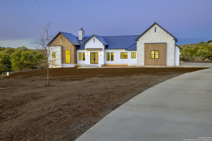 Front exterior of a new home in , New Braunfels, TX, highlighting curb appeal (Image 27).