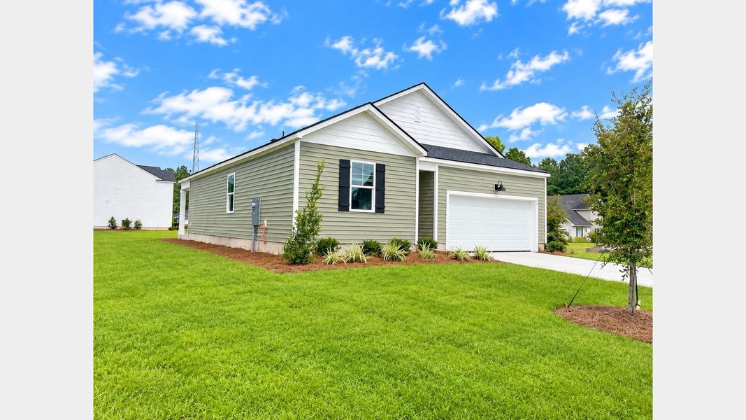 Front exterior of a new home in Cypress Landing, Hardeeville, SC, highlighting curb appeal (Image 2). Front exterior of a new home in Cypress Landing, Hardeeville, SC, highlighting curb appeal (Image 2).