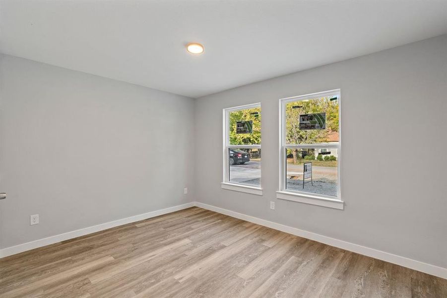 Unfurnished room featuring light wood-type flooring