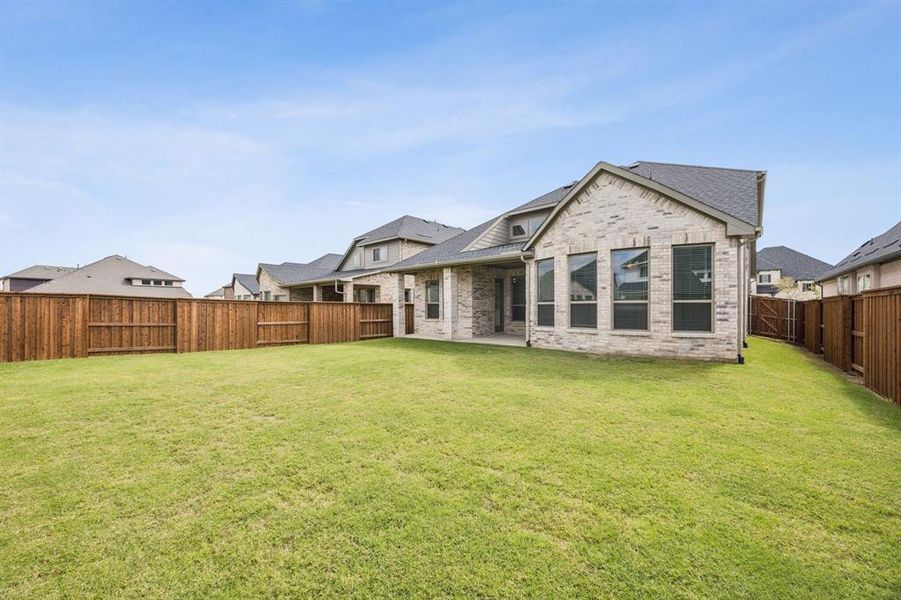 Exterior details and patio area of a home in , Prosper (Image 3). Exterior details and patio area of a home in , Prosper (Image 3).