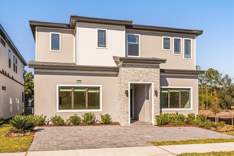 Front exterior of a new home in , Orlando, FL, highlighting curb appeal (Image 25).