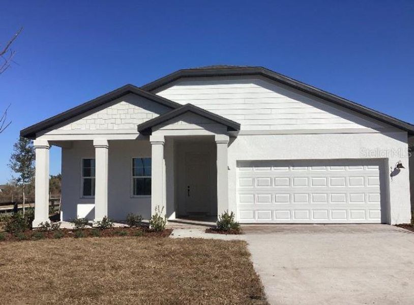 Front exterior of a new home in Sunbrooke, St. Cloud, FL, highlighting curb appeal (Image 1). Front exterior of a new home in Sunbrooke, St. Cloud, FL, highlighting curb appeal (Image 1).