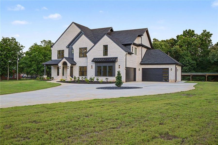 Front exterior of a new home in , Monroe, GA, highlighting curb appeal (Image 24). Front exterior of a new home in , Monroe, GA, highlighting curb appeal (Image 24).