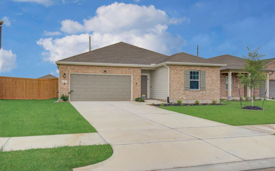 Front exterior of a new home in Sunterra, Katy, TX, highlighting curb appeal (Image 21). Front exterior of a new home in Sunterra, Katy, TX, highlighting curb appeal (Image 21).