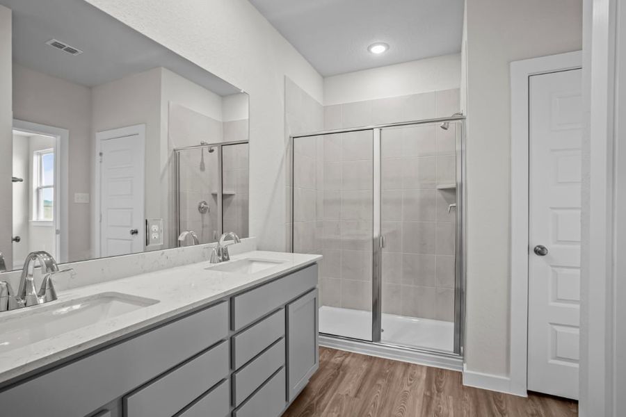 A bathroom with a glass shower.