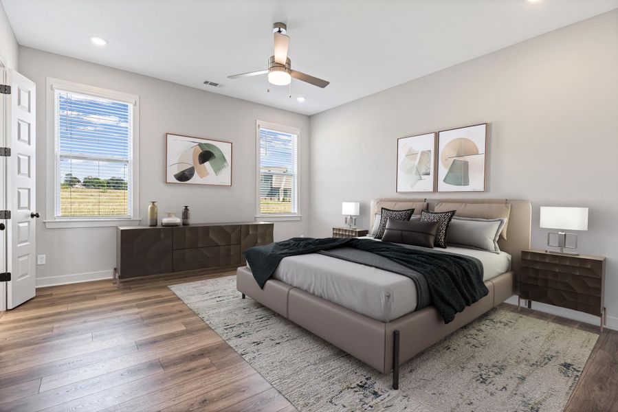 Recessed lighting, wood-finish flooring, two large windows, and a ceiling fan with integrated lighting