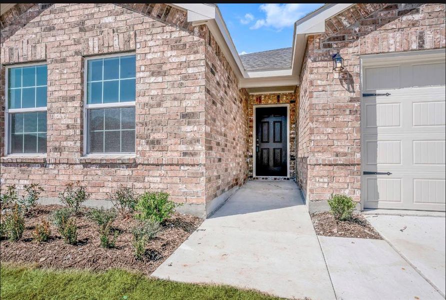 Front exterior of a new home in , Forney, TX, highlighting curb appeal (Image 1). Front exterior of a new home in , Forney, TX, highlighting curb appeal (Image 1).