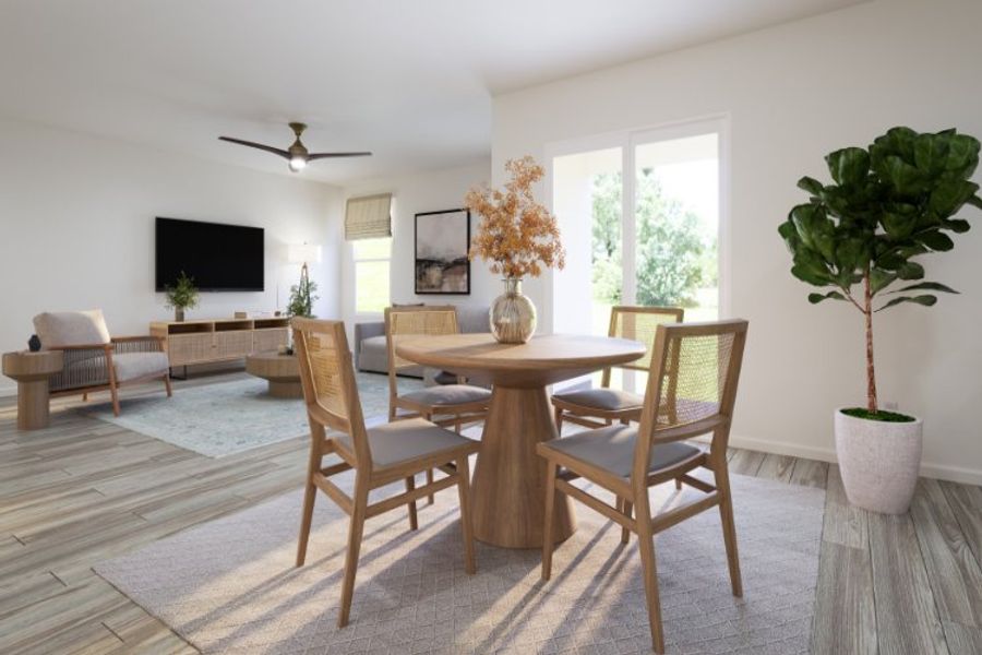 A dining room with a table and chairs.