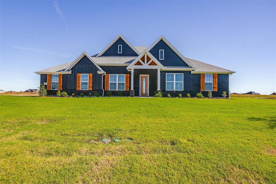 View of front of home featuring a front lawn