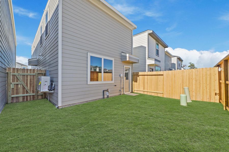 Exterior details and patio area of a home in Bridges on Lake Houston Villas, Humble (Image 3). Exterior details and patio area of a home in Bridges on Lake Houston Villas, Humble (Image 3).
