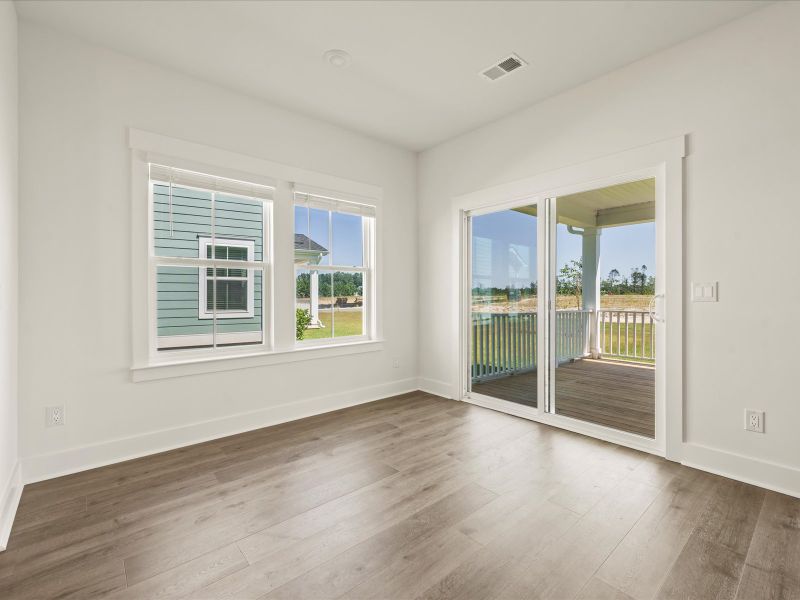 Spacious, unfurnished interior of a new home in The Coves at Lakes of Cane Bay, Summerville (Image 20).