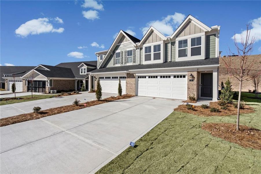 Front exterior of a new home in Villas at Gold Creek, Dawsonville, GA, highlighting curb appeal (Image 21).