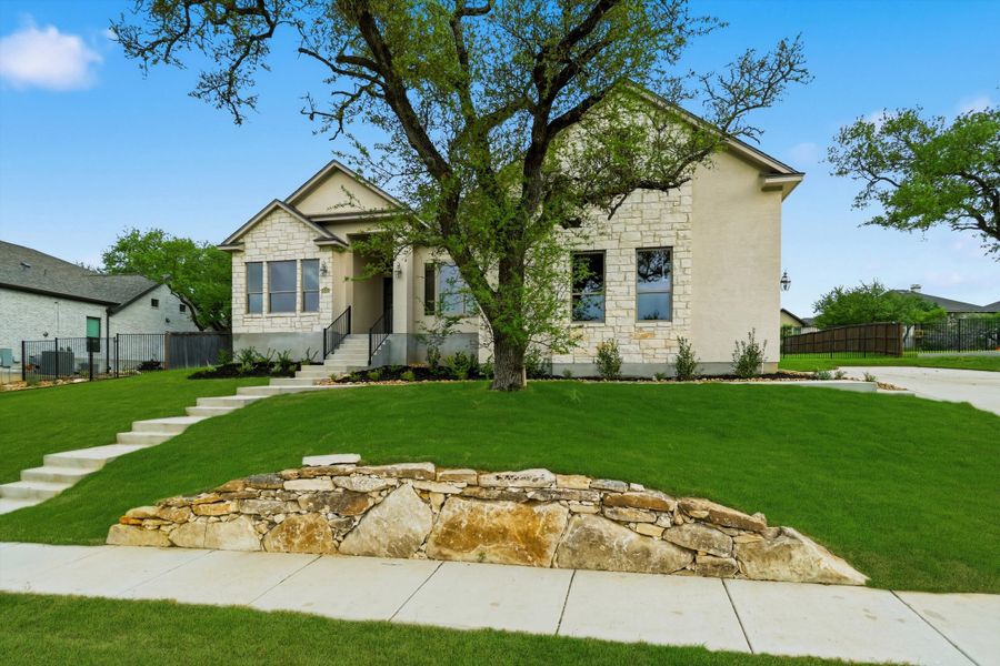 Front exterior of a new home in Johnson Ranch, Bulverde, TX, highlighting curb appeal (Image 23). Front exterior of a new home in Johnson Ranch, Bulverde, TX, highlighting curb appeal (Image 23).