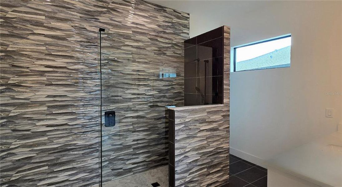 Gorgeous textured tile in the walk-in shower.