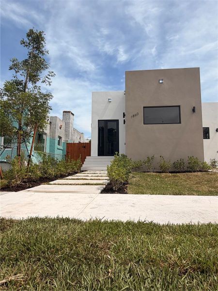 Front exterior of a new home in , Miami, FL, highlighting curb appeal (Image 1). Front exterior of a new home in , Miami, FL, highlighting curb appeal (Image 1).