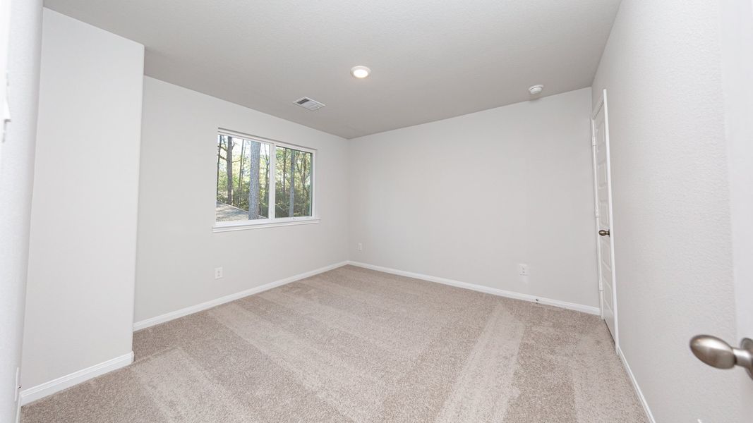 Representative unfurnished interior of a home built from the The Bronte - Walden on Lake Conroe by Legend Homes in Lake Conroe Area Homes, Montgomery (Image 17).