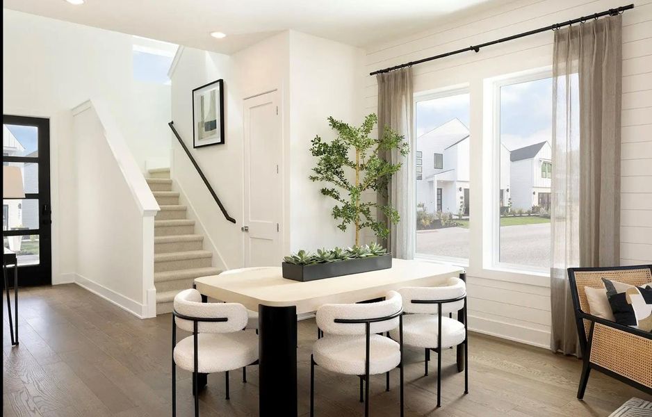 Dining room with plenty of natural light and hardwood / wood-style floors