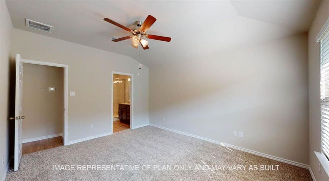 Unfurnished bedroom with carpet, vaulted ceiling, baseboards, and connected bathroom Unfurnished bedroom with carpet, vaulted ceiling, baseboards, and connected bathroom
