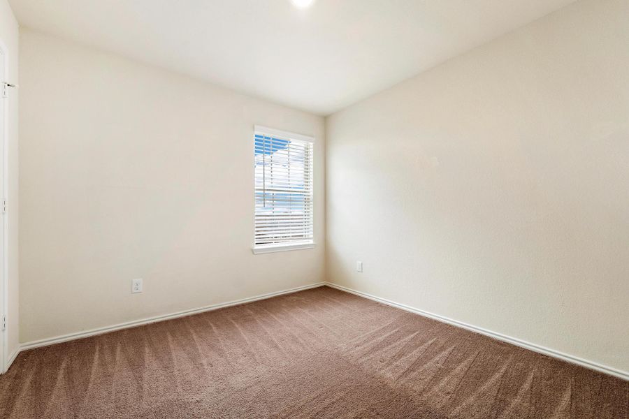 A well-lit, neutral-toned room ready for personalization. A well-lit, neutral-toned room ready for personalization.