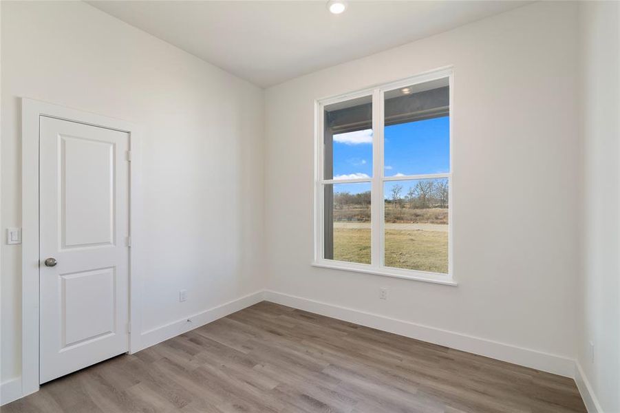 Spare room with light wood-type flooring