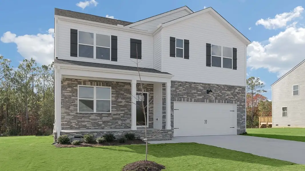 Front exterior of a new home in Gretchen Pines, West End, NC, highlighting curb appeal (Image 2). Front exterior of a new home in Gretchen Pines, West End, NC, highlighting curb appeal (Image 2).