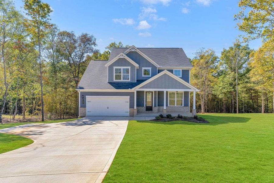 Front exterior of a new home in Waters Edge, Mansfield, GA, highlighting curb appeal (Image 1). Front exterior of a new home in Waters Edge, Mansfield, GA, highlighting curb appeal (Image 1).