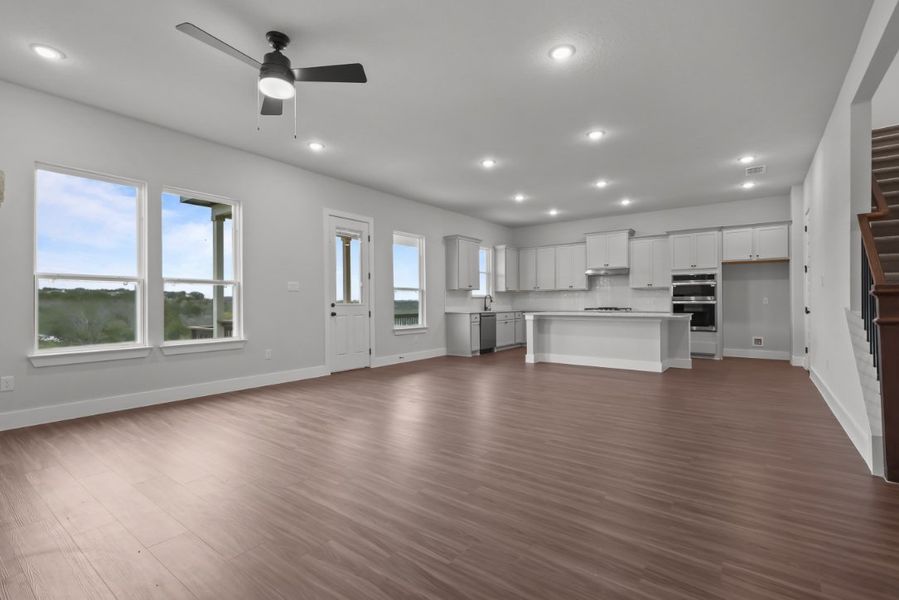A large kitchen with white cabinets. A large kitchen with white cabinets.