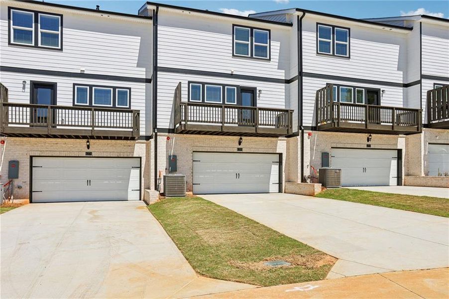 Front exterior of a new home in Hemingway - Highland Series, Cumming, GA, highlighting curb appeal (Image 23). Front exterior of a new home in Hemingway - Highland Series, Cumming, GA, highlighting curb appeal (Image 23).
