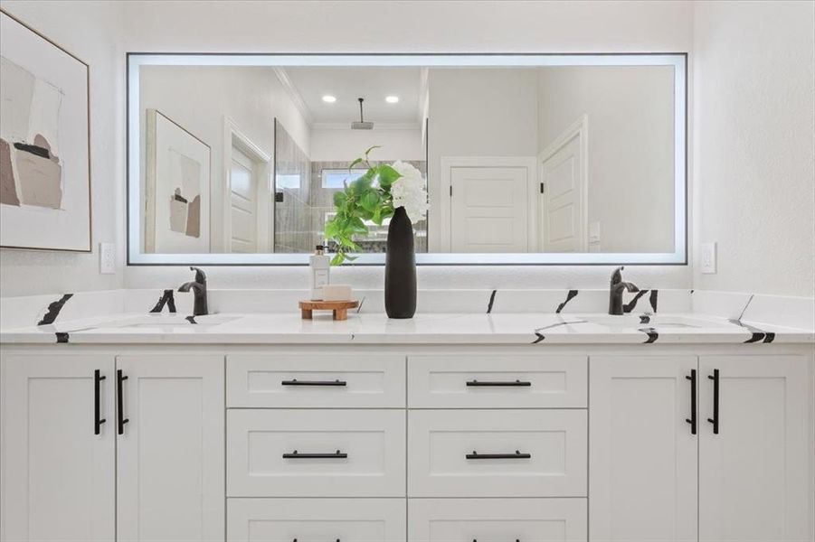 Primary bath with double vanity, a shower stall, touch screen LED mirror, & walk in closet. Primary bath with double vanity, a shower stall, touch screen LED mirror, & walk in closet.