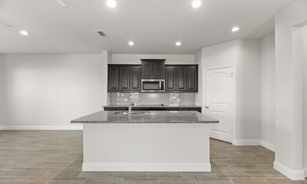 Representative exterior photo of a completed home built from the Granbury by Impression Homes in Main Street Village, Mansfield, TX (Image 5). Representative exterior photo of a completed home built from the Granbury by Impression Homes in Main Street Village, Mansfield, TX (Image 5).