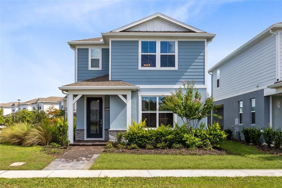 Front exterior of a new home in Isles of Lake Nona, Orlando, FL, highlighting curb appeal (Image 1). Front exterior of a new home in Isles of Lake Nona, Orlando, FL, highlighting curb appeal (Image 1).