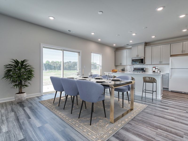 A large kitchen island anchors the spacious kitchen and great room. A large kitchen island anchors the spacious kitchen and great room.