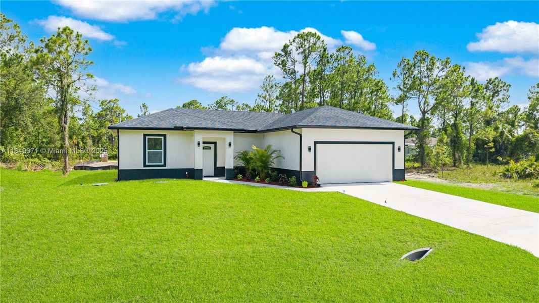 Front exterior of a new home in , Lehigh Acres, FL, highlighting curb appeal (Image 17). Front exterior of a new home in , Lehigh Acres, FL, highlighting curb appeal (Image 17).